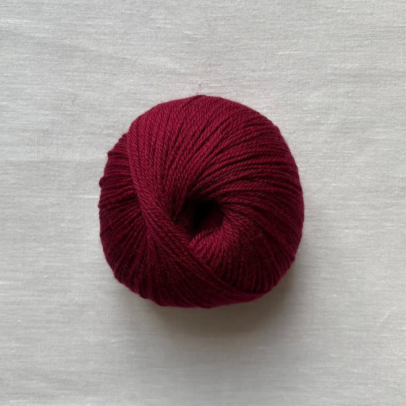 pelote de laine mérinos à tricoter de la marque fonty, de couleur bordeaux