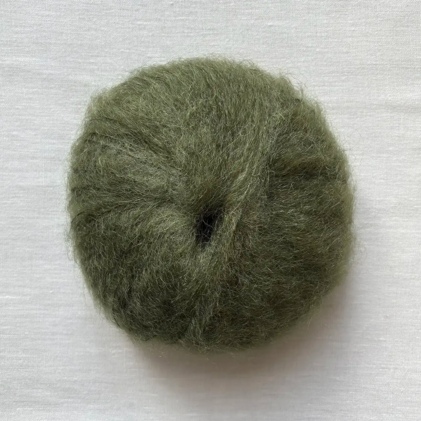 pelote de laine mohair à tricoter de la marque fonty, de couleur vert foret